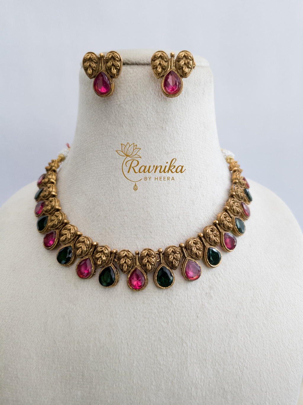 non idol necklace with pink and green stone