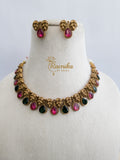 non idol necklace with pink and green stone