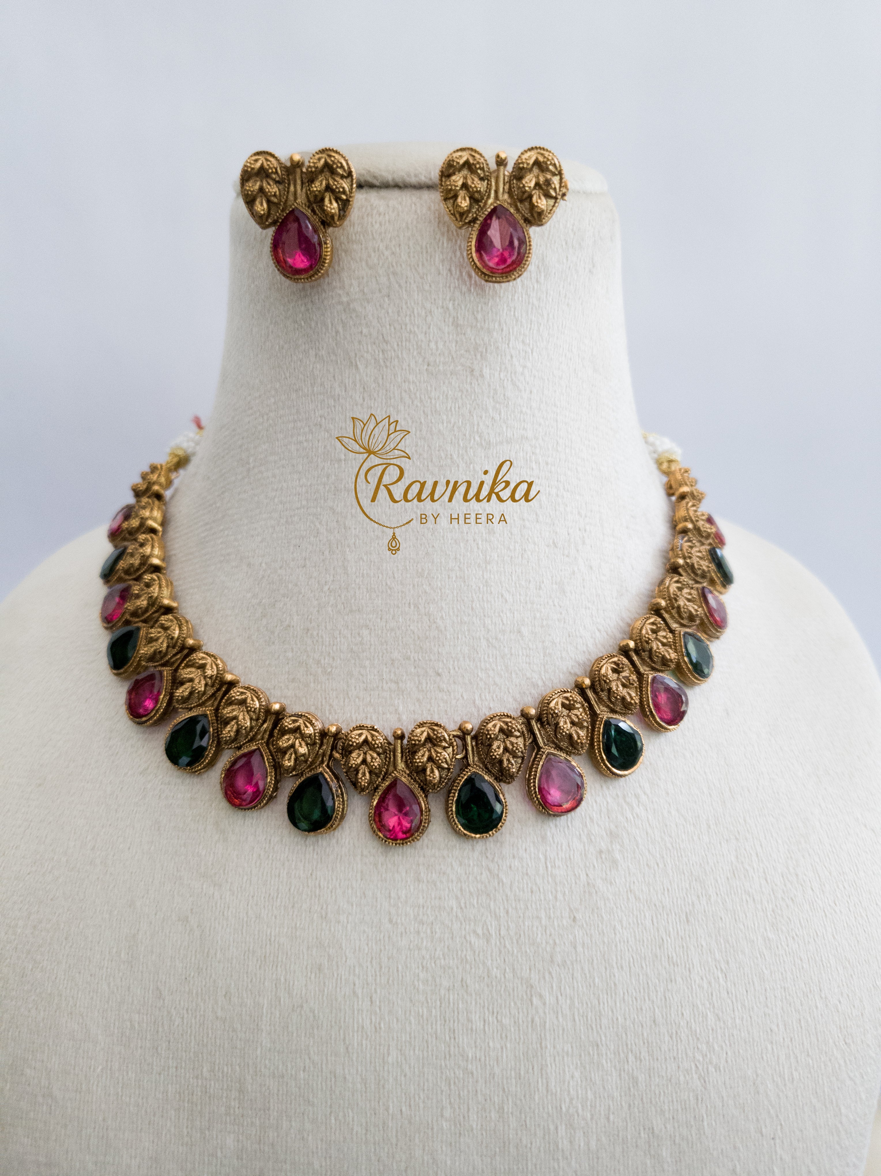 non idol necklace with pink and green stone