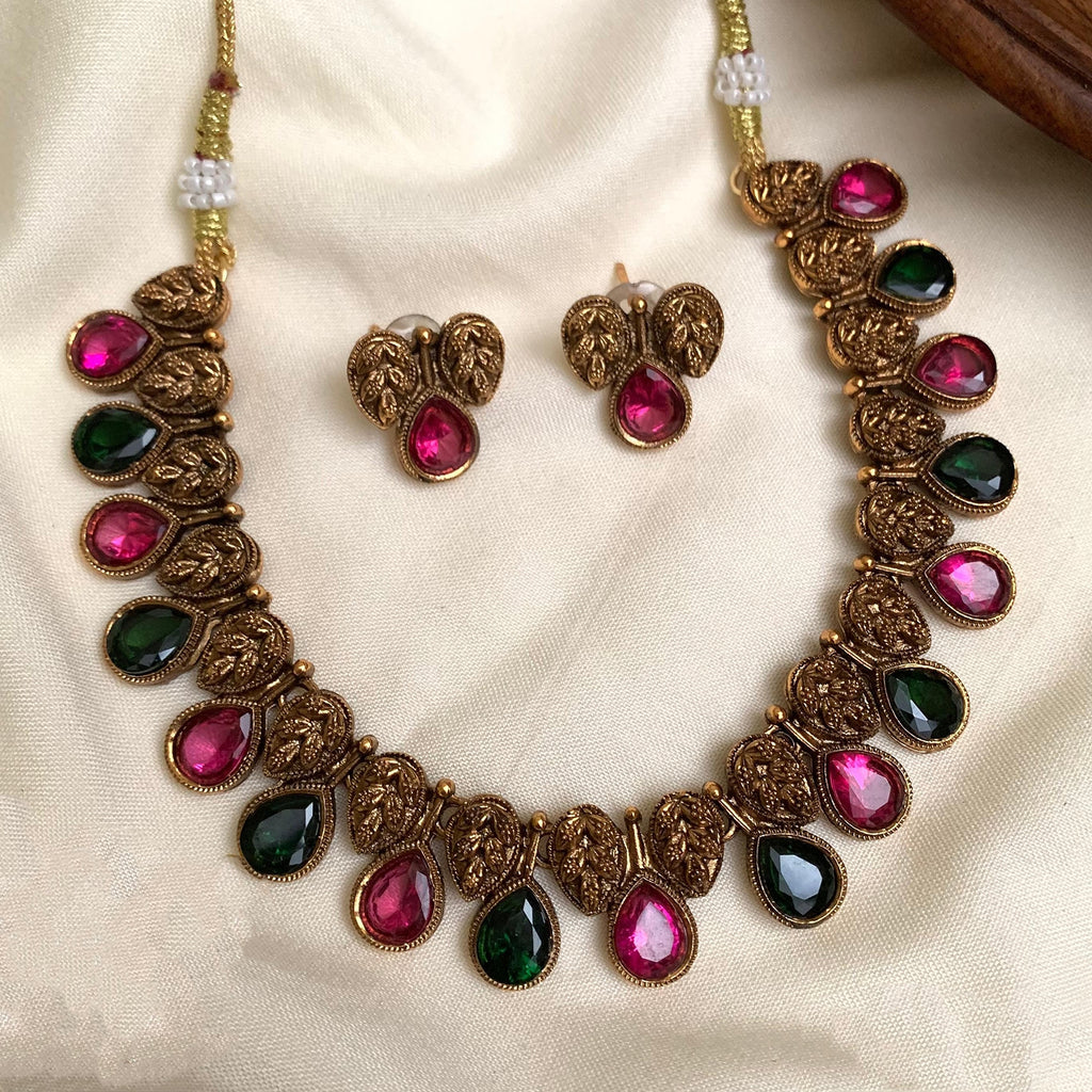 non idol necklace with pink and green stone